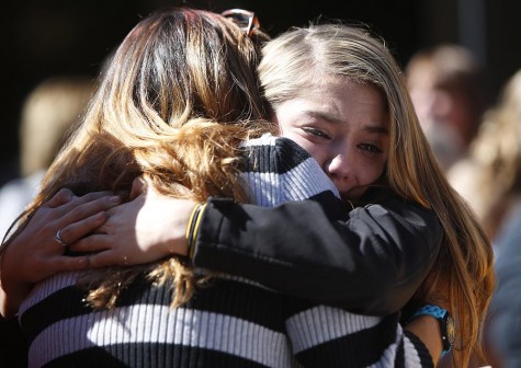 Students arriving from campus are greeted by friends and family as they arrive at the fairgrounds on Oct. 1, 2015 in Roseburg, Ore. As many as 10 people were killed and more injured when a shooter opened fire at Oregon&apos;s Umpqua Community College on Thursday. (Andy Nelson/The Register-Guard/Zuma Press/TNS)