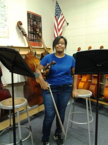 Maya Stevens with her violin.