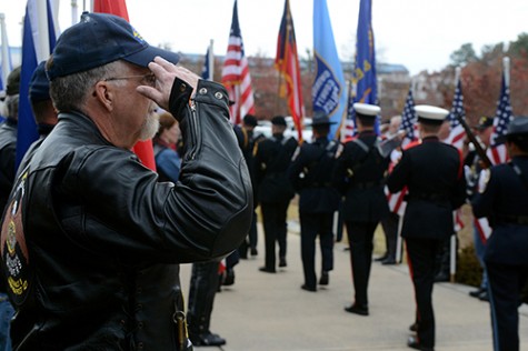 Patriot Rider Richard Hally, 67, salutes as the colors are retired following Gwinnett County&apos;s Veterans Day ceremony at Fallen Heroes Memorial in Lawrenceville, Georgia, Sunday November 11, 2012. (Kent D. Johnson/Atlanta Journal-Constitution/MCT)