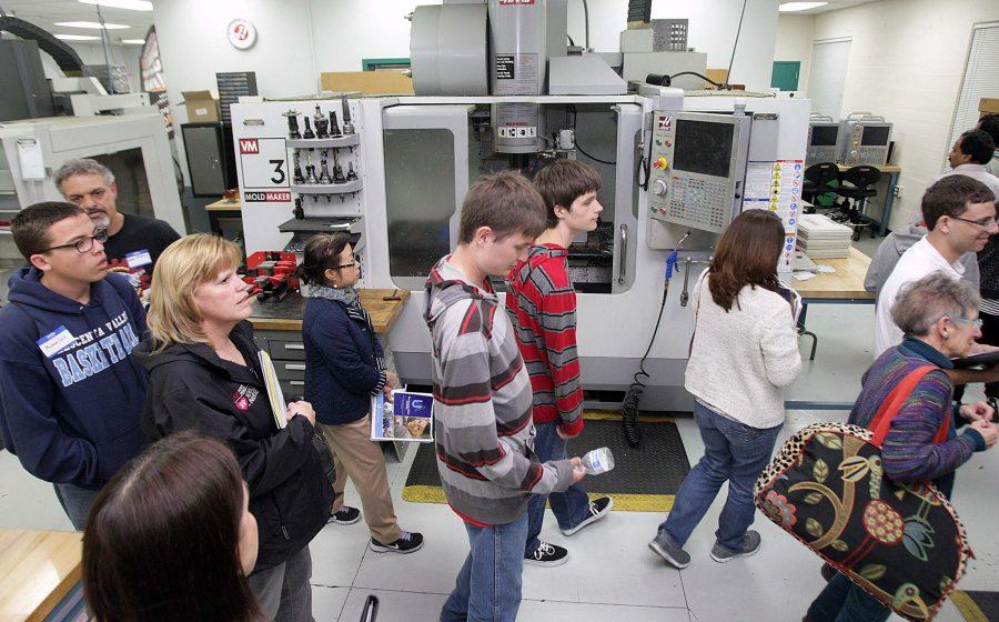 Students and parents are given a tour of the Engineering Design Manuafacturing HUB, where the future classes will be held, at an information meeting for a brand new program called the Uniquely Abled Academy at Glendale Community College on May 5, 2016 in Glendale, Calif. The academy trains high-functioning autistic students how to use a CNC machine. (Tim Berger/Los Angeles Times/TNS)