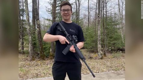 A photo of Rittenhouse, posing with an AR-15 style rifle, taken off of his Tik Tok before his account was removed.