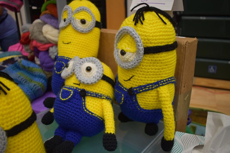 A couple crocheted family minions sit on a table to be sold at the Craft Fair.