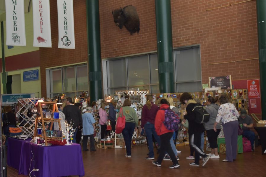 Numerous buyers filled the hallways looking to buy various items.