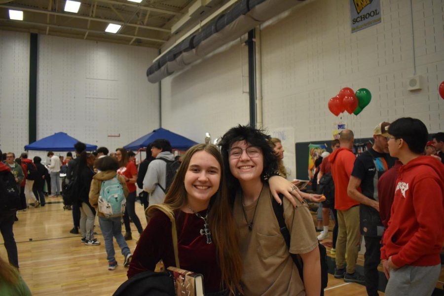 Sofiia Znakharenko and Oliver Hanover smile as hundreds of students showed up to support DECAs Marketplace.